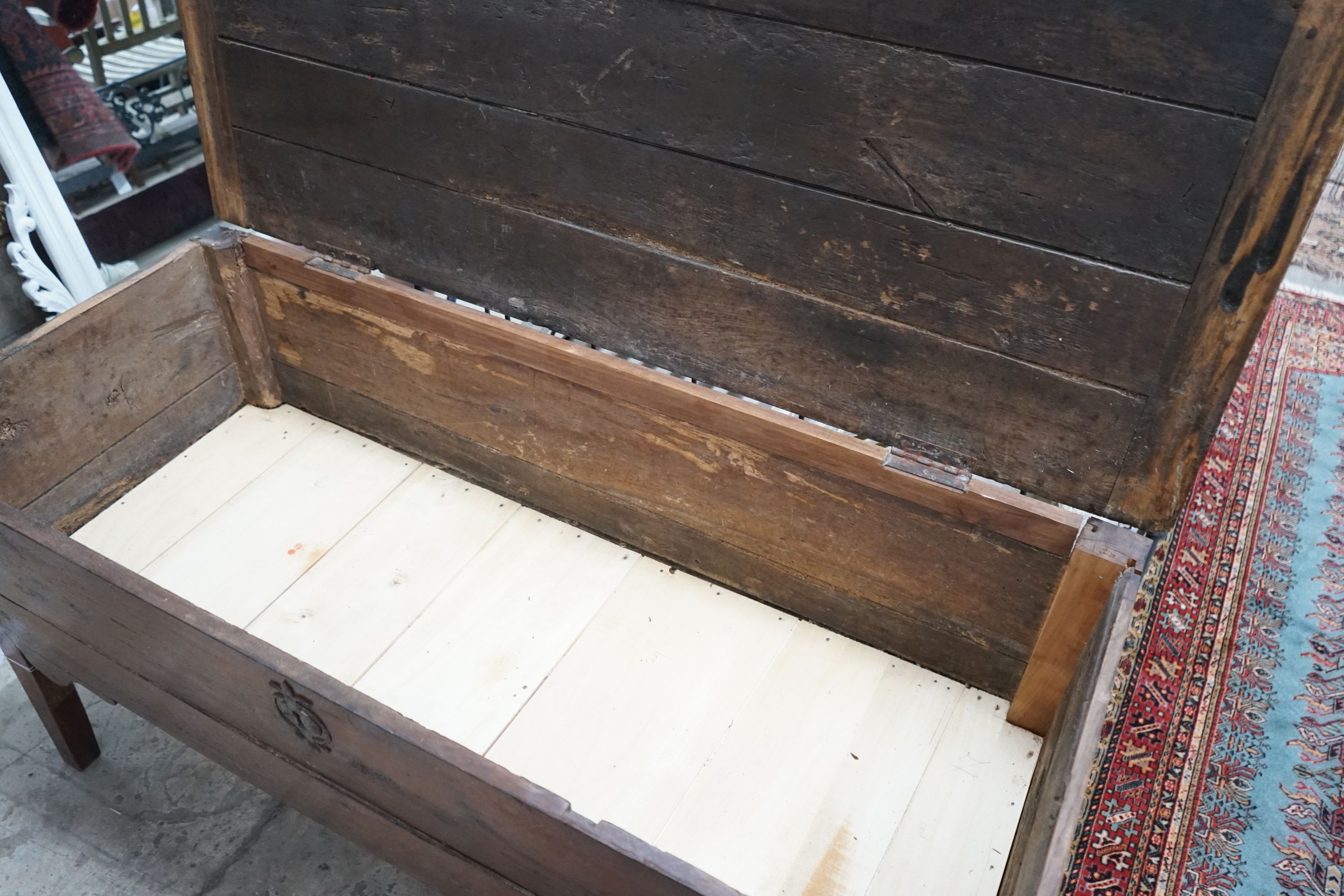 An early 19th century continental oak hinged top dough bin, width 145cm, depth 62cm, height 73cm